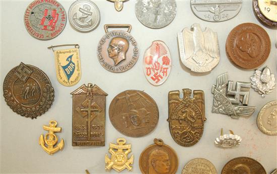 A large collection of various German Third Reich badges,